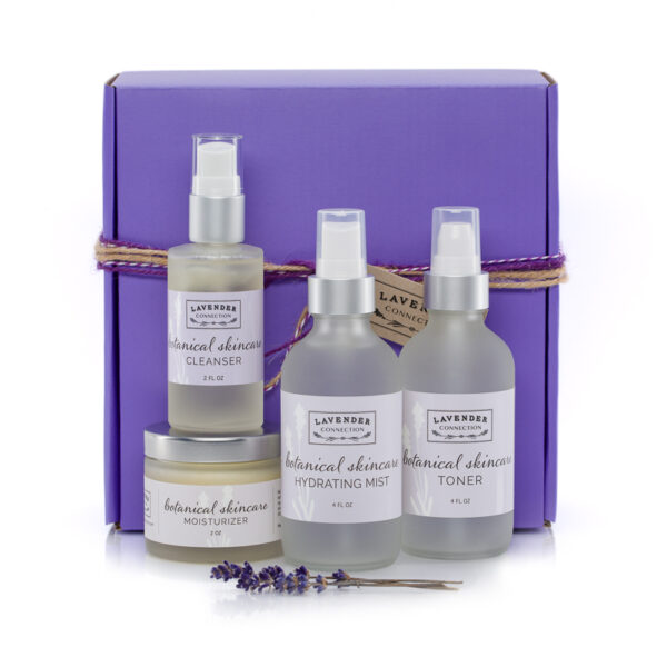 Lavender Botanical Hydrating Mist, Toner, Moisturizer and Cleanser in foreground, with purple gift box in background