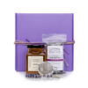 Lavender Earl Grey Tea, Lavender Honey, mesh tea strainer in foreground, with purple gift box in background