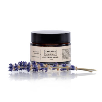 Lavender salve in amber glass jar with fresh lavender sprig, made in Sequim Washington